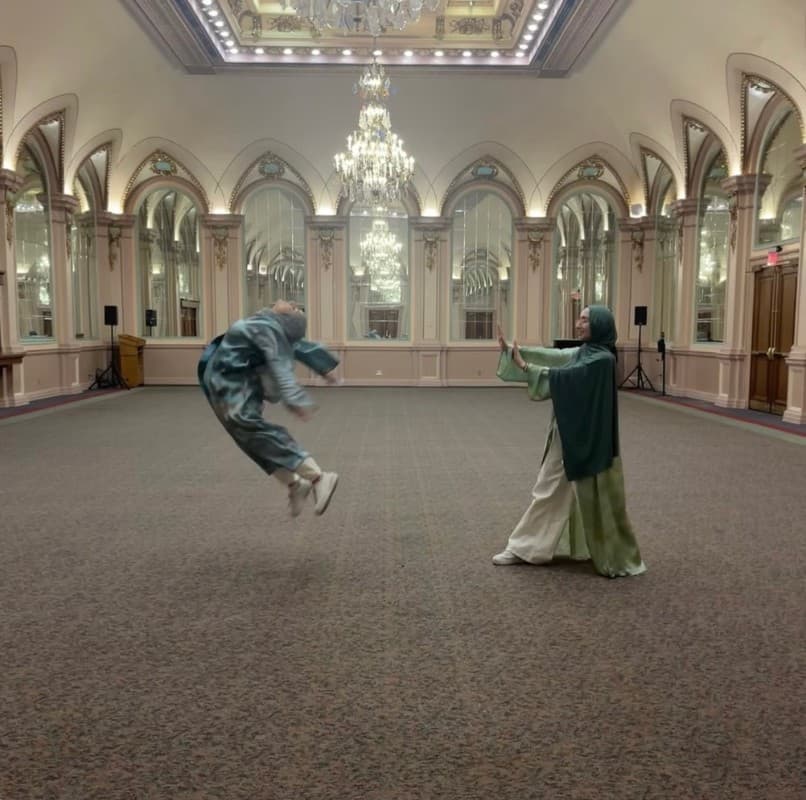 Playful photo in a grand hall with a force-push pose