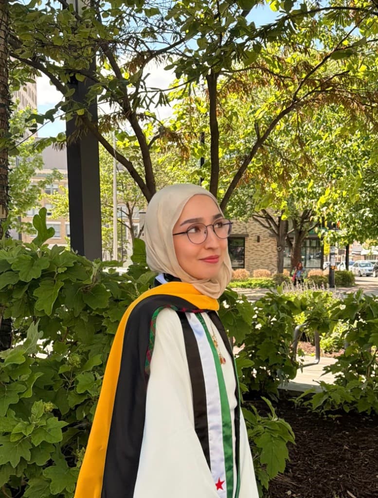 Portrait of Zeana El-Hajomar in graduation regalia