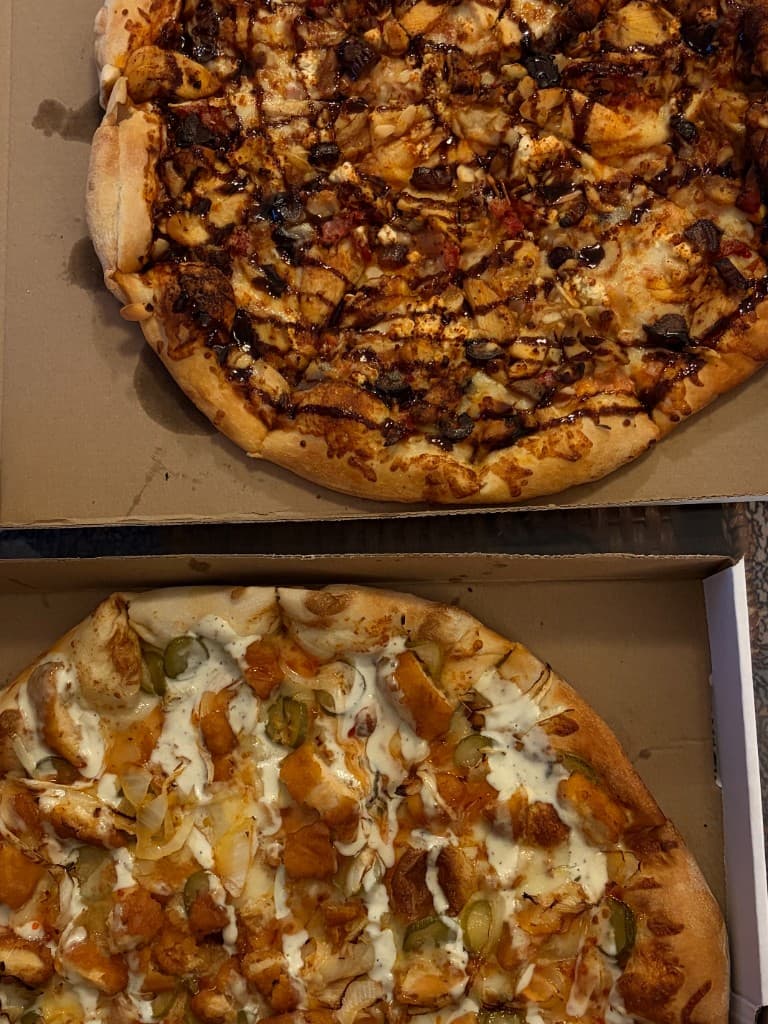 Casablanca and Pickalicious pizzas in delivery boxes