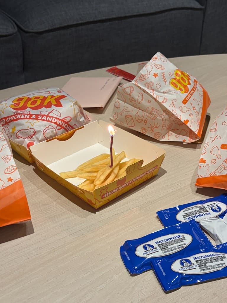Fries with a birthday candle at a surprise celebration